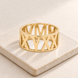 Custom Wide Cut Out Ring glamour photo - gold openwork band on ivory ceramic tile Anthology Jewelry