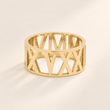 Custom Wide Cut Out Ring hero photo - gold 11 mm openwork Roman numeral band Anthology Jewelry
