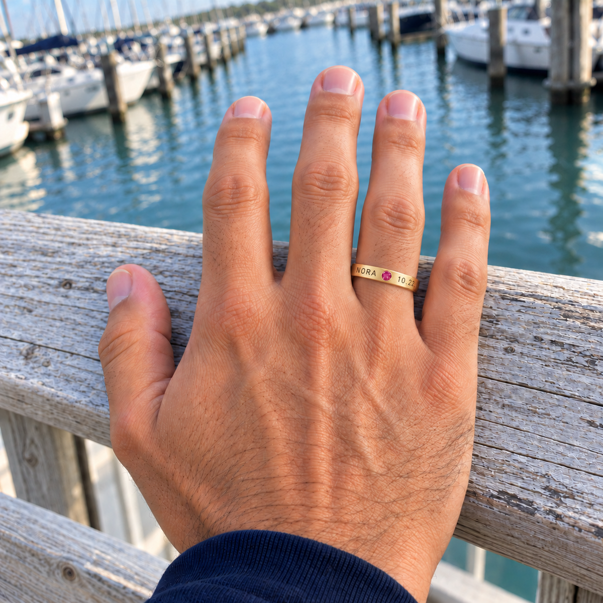 Custom Date & Name Birthstone Stacking Ring casual modeled photo - gold ring with NORA and 10.22 beside a pink tourmaline Anthology Jewelry