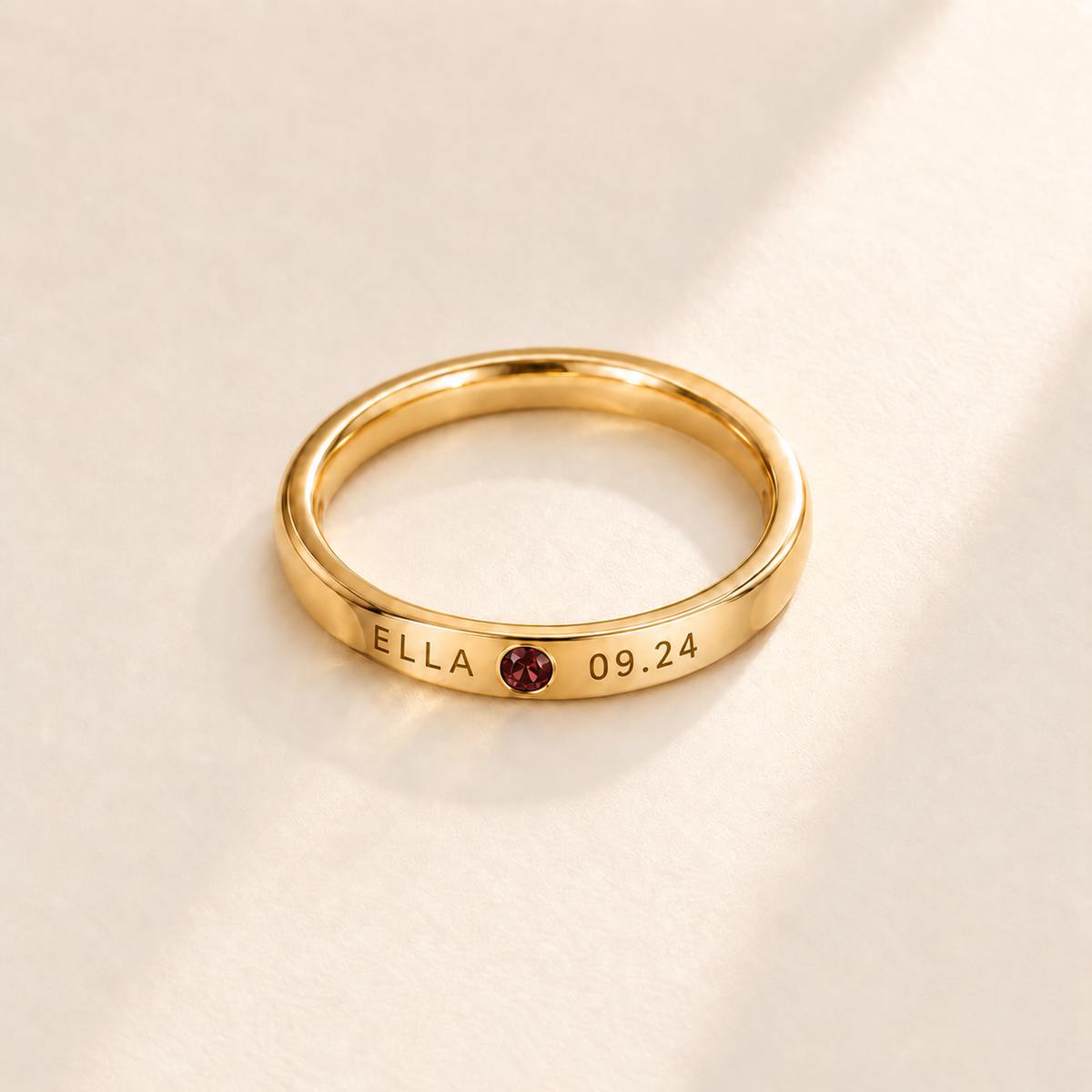 Custom Date & Name Birthstone Stacking Ring, January Garnet, Gold finish. Illustrative product rendering; natural gemstone colors may vary.