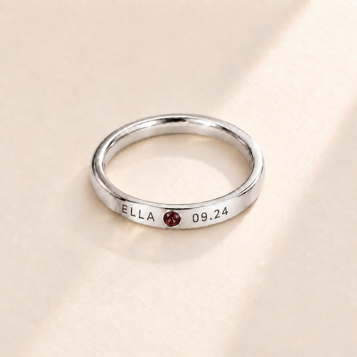 Custom Date & Name Birthstone Stacking Ring, January Garnet, Silver finish. Illustrative product rendering; natural gemstone colors may vary.