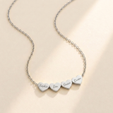 Generations Heart Necklace hero photo - silver multi-heart necklace engraved with Sophie, Ben, Grace and Owen Anthology Jewelry