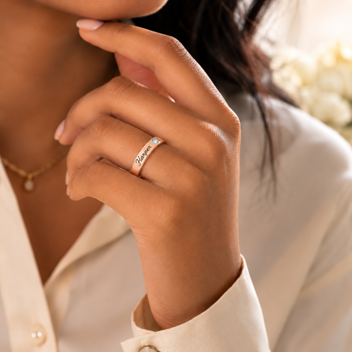 Name Ring with Birthstone (Classic Band) lifestyle photo - rose gold name ring with blue birthstone worn on hand Anthology Jewelry